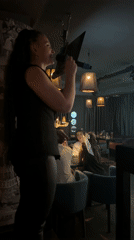 Friends toast drinks at Izhevsk restaurant during evening gathering
