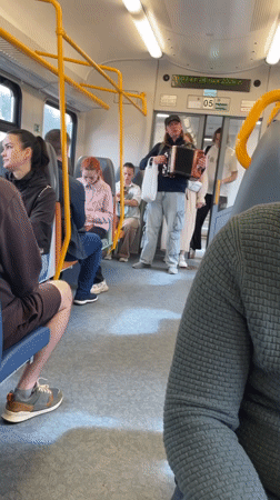 Accordionist performs for train passengers in Russia