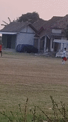 Soccer and a mosque road at golden hour in Troso