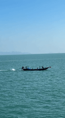 Ferry crossing on turquoise waters off Don Sak, Thailand