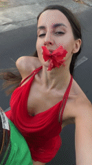 Woman films selfie while traveling in North Kuta, Indonesia