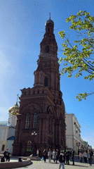 Tourist captures bell tower and fountain at Orthodox church site