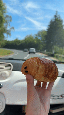 Pain au chocolat break inside a Fiat 500 in Normandy
