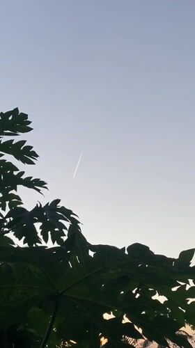 Aircraft contrails observed across evening sky in Achara, Nigeria