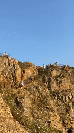 Blanes coastline in full summer swing, cliff to beach