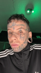 Heavily tattooed individual photographed multiple times in Buenos Aires