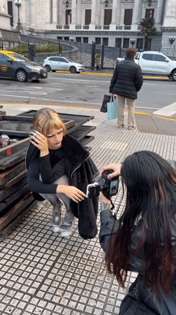 Two women pose for street photos in Buenos Aires