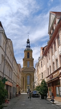 Strolling through Dzierżoniów's town square on a summer afternoon