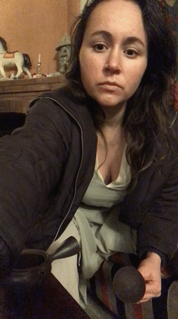 Woman prepares tea indoors in Kabali, Georgia