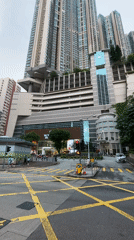 Hong Kong street intersection captured showing typical urban traffic markings