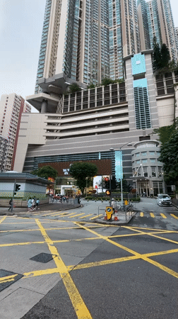 Hong Kong street intersection captured showing typical urban traffic markings