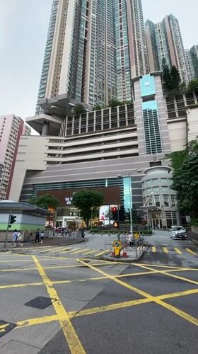 Hong Kong street intersection captured showing typical urban traffic markings