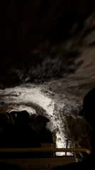 Cave tour train carries tourists through Slovenia underground formations