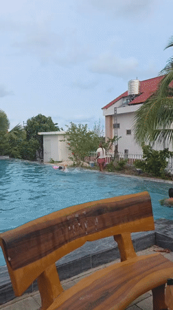 Children play at swimming pool in Mui Ne, Vietnam