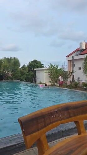 Children play at swimming pool in Mui Ne, Vietnam