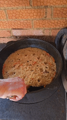 Home cooking pilaf preparation documented in Russian village garden