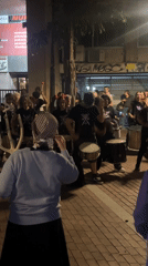 Street drummers perform nighttime show in Barcelona