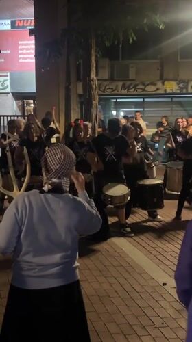 Street drummers perform nighttime show in Barcelona