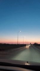 Evening commute captured on Russian highway at sunset