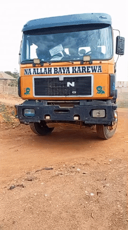 Orange dump truck with Arabic text spotted in Bukuru