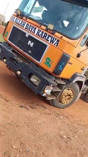 Orange dump truck with Arabic text spotted in Bukuru