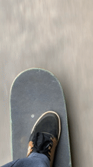 Skateboarder rides at graffiti-covered bowl beneath Petersburg bridge
