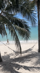 Woman walks tropical beach in Vietnam coastal scene