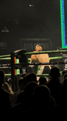Boxing match between two fighters in ring corner