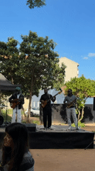 Street musicians perform outdoor concert in Lisbon park