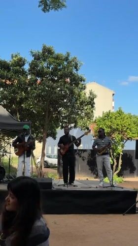 Street musicians perform outdoor concert in Lisbon park