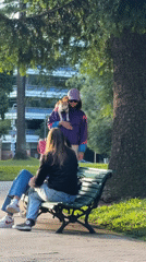 Woman walks multiple pets simultaneously through Buenos Aires park