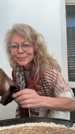 Woman with Siamese cat captured in early morning Ramat Gan