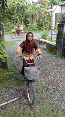 Student with bicycle observed in Baron, Indonesia residential area