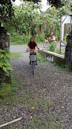 Student with bicycle observed in Baron, Indonesia residential area