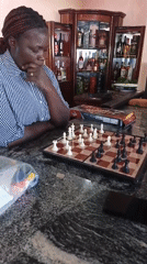 Chess and waterfront leisure at a venue in Kwang, Nigeria