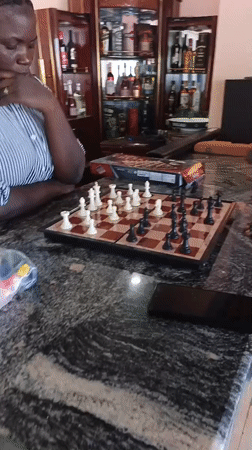 Chess and waterfront leisure at a venue in Kwang, Nigeria
