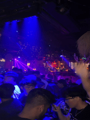 Nightclub scene with colorful lights captured in Xuanwu District