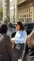 Ordinary Paris street life captured during sunny afternoon