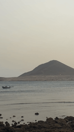 Peaceful coastal scene with boats captured near Granadilla, Spain