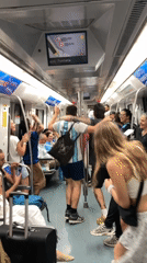 Barcelona fans celebrate on the metro after a match