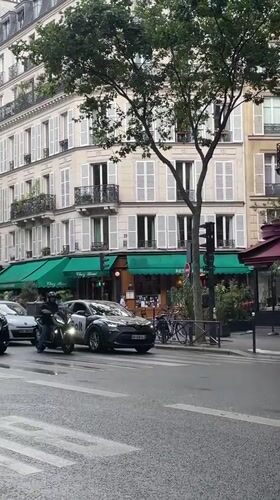 Overcast afternoon street scene documented in central Paris