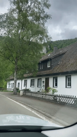 Car travels rural road near Beuron, Germany