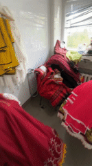 Indoor scenes: costume room, classroom activity, yellow text display