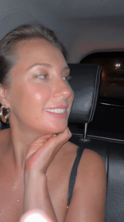 Two women travel by car through Kuta Selatan at night