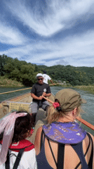 Traditional wooden boat tour drifting down the Hozu River, Kameoka