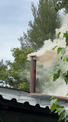 Smoky chimney and backyard nature in Biysk, Russia