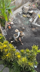 Barefoot scooter rider navigates construction zone in Ubud
