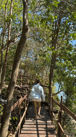 Morning wildlife and human activity captured in Thai beach town