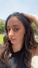 Midday selfies in a Milan park, blue sky overhead