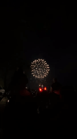 Nighttime fireworks display draws crowds in Rusanovo, Russia